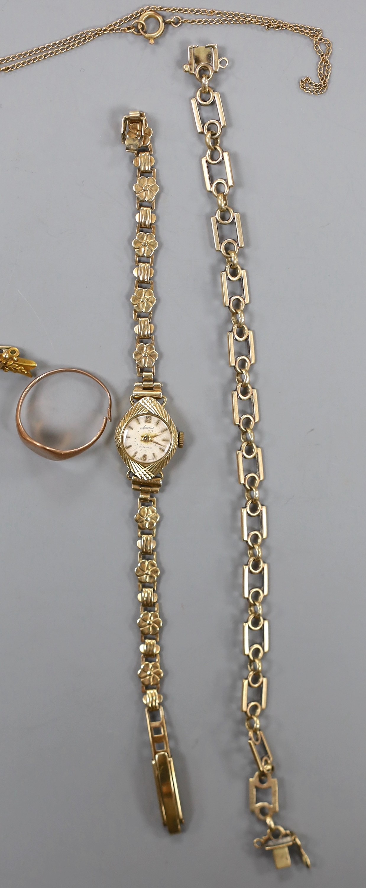 A lady's 9ct gold Accurist manual wind wrist watch, on a 9ct gold bracelet, gross weight 11.2 grams, one other lady's yellow metal wrist watch, three 9ct gold rings, a 9ct gold bracelet, a 9ct cross pendant on 9ct chain,